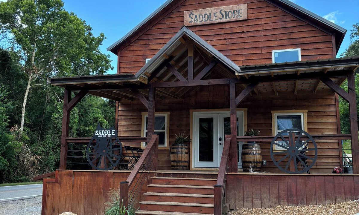 Mammoth Spring House | Float the river Historic 1916 Saddle Store with covered porchMammoth Spring Ar