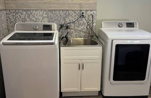 Miller Beach Apartment | Blocks from the beach with giant covered deck, firepit, and grill!