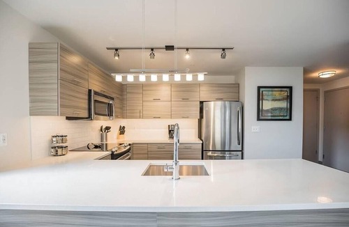 Midtown Village Apartment | Bright 2BR home steps away from City Hall