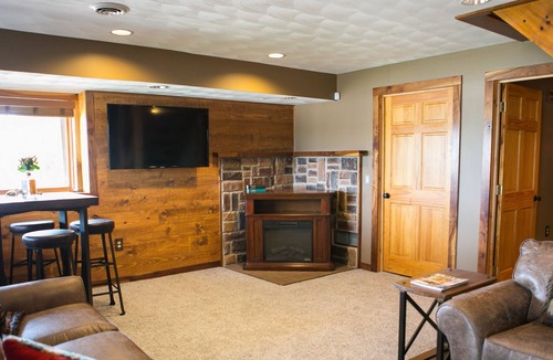 Magnet Cabin | Come sit, relax and unwind on the covered wraparound deck along the River.