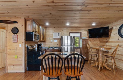 Bryant Cabin | Mr Hills Mercantile Cabin with a hot tub
