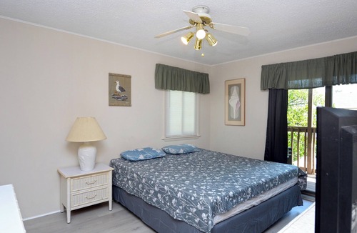 Caine Woods Condo | Quaint, but pristine 2-bedroom condo with free WiFi and an outdoor pool located uptown on the bayside in a peaceful, family-friendly neighborhood!