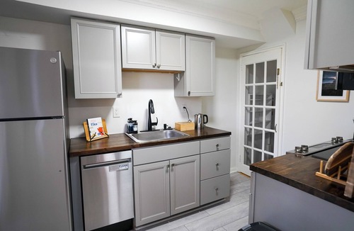 Potomac West House | Unique duplex that has 2 family rooms and 2 kitchens