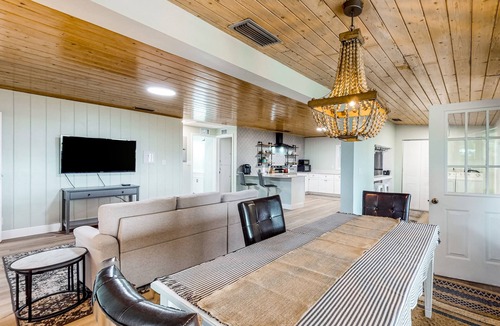 Candler House | Waterfront stay with a dock, firepit, grill, sunroom, separate studio, W/D, & AC