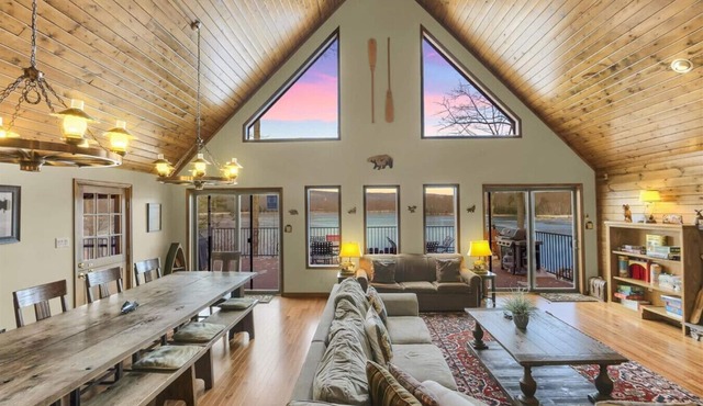 Family-friendly lakefront cabin/chalet with incredible views, private beach, lakeside firepit, boats, hot tub, multiple game rooms, and more