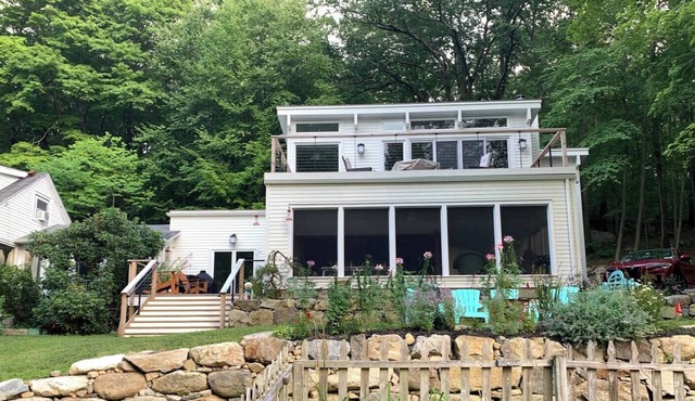 Serene wooded 15 acre property with pool and two separate guest houses in summer