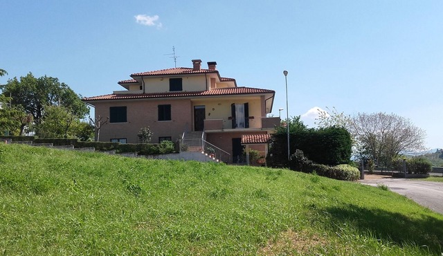 spacious apartment with a separate entrance on the ground floor and a small garden