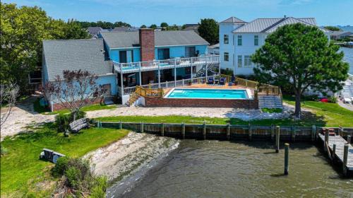 Spacious home with heated pool, dock access, and scenic views